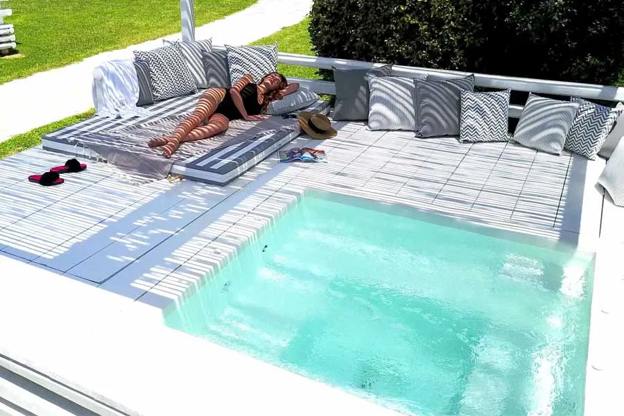 Luxury suites with private jacuzzi kiosks in the garden at Ow Andros, Andros Island, Greece