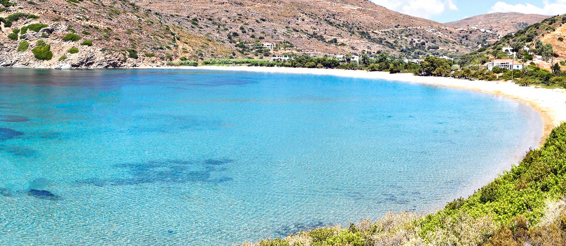 Aerial view of Andros Island, Greece showing turquoise waters and traditional white villages